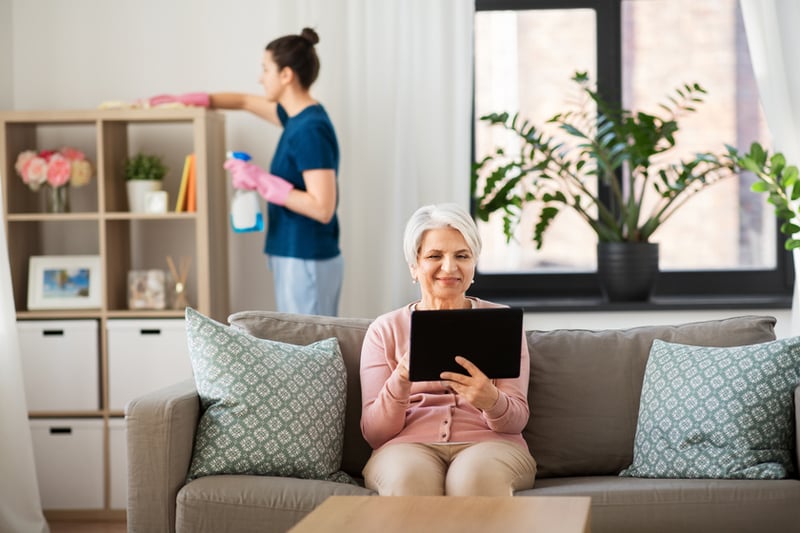 Woman on a tablet sitting on a couch